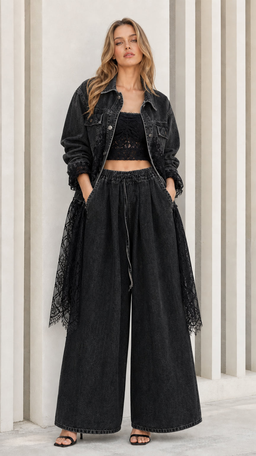 Model wearing washed black denim jacket and wide-leg pants set with black lace