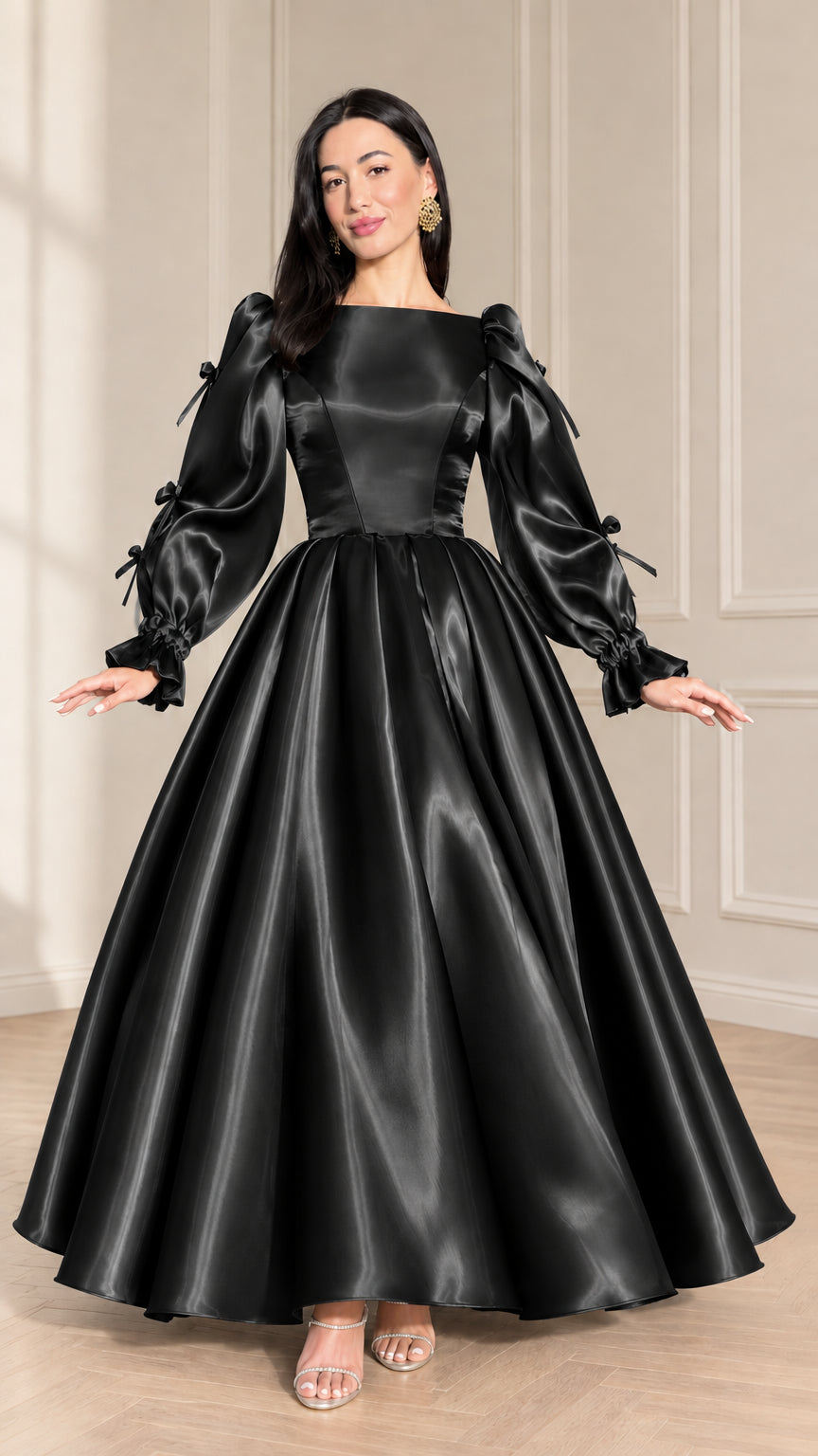 Front full-length view of black satin ball gown with puff sleeves