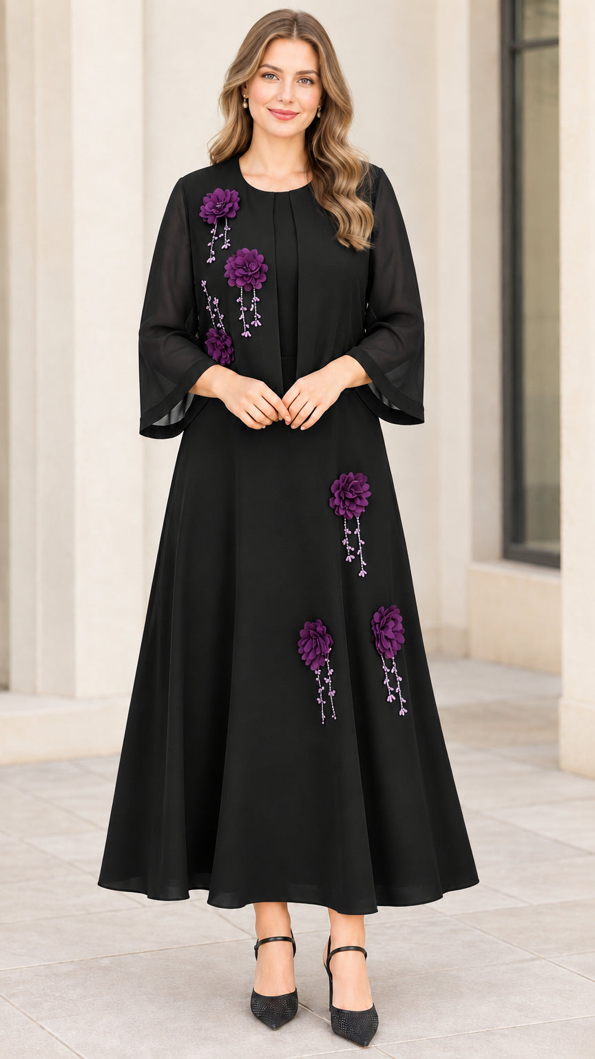 Full front view of black chiffon maxi dress with purple floral appliqué embellishments and matching jacket