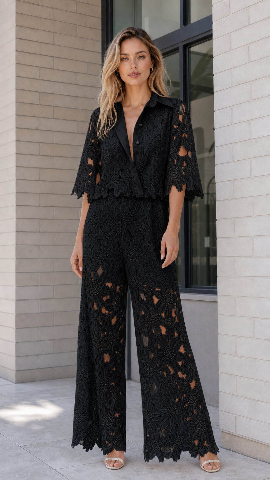 Model wearing black floral lace two-piece top and wide-leg pant set