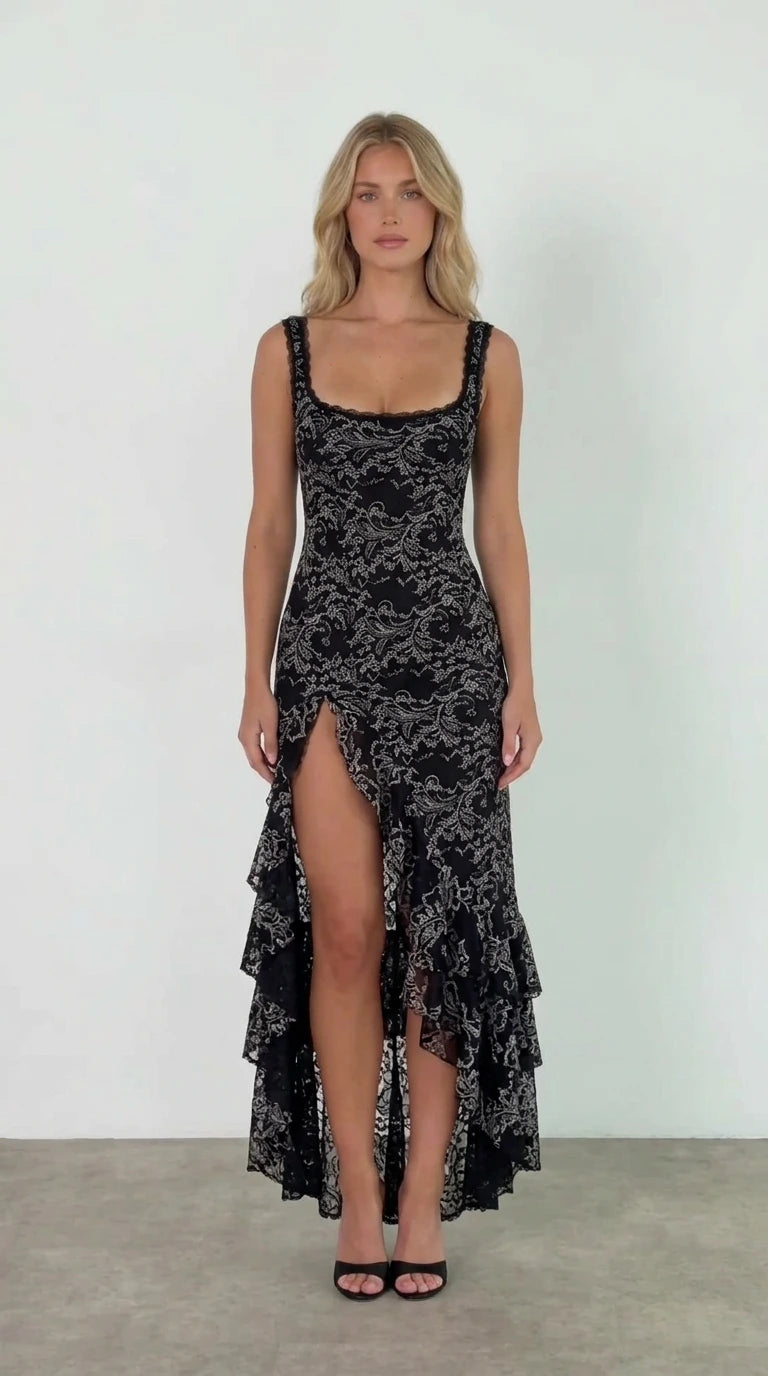 Front view of model wearing black floral lace ruffle high slit maxi dress