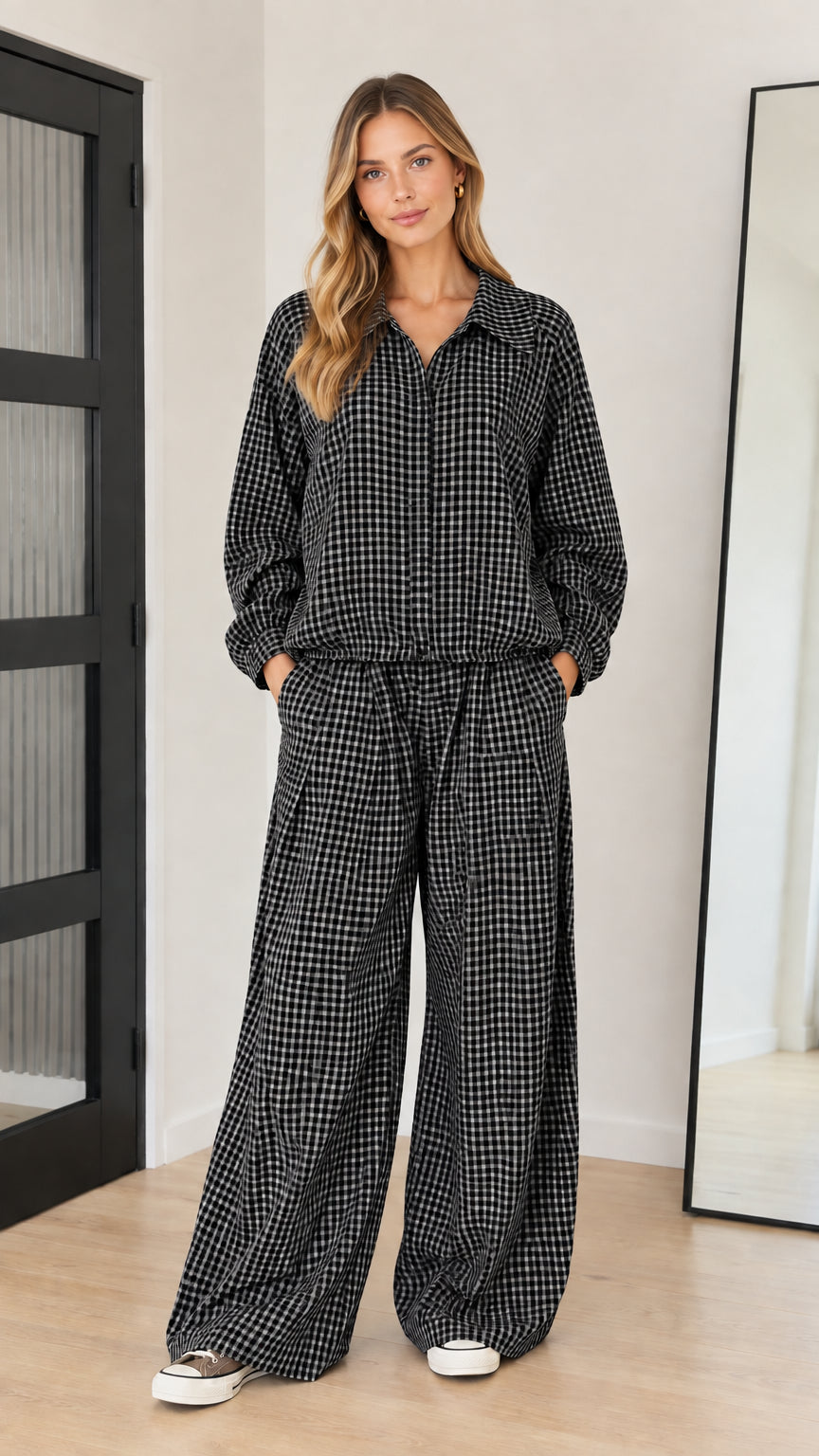 Front full-length view of model wearing black and white gingham two-piece matching set
