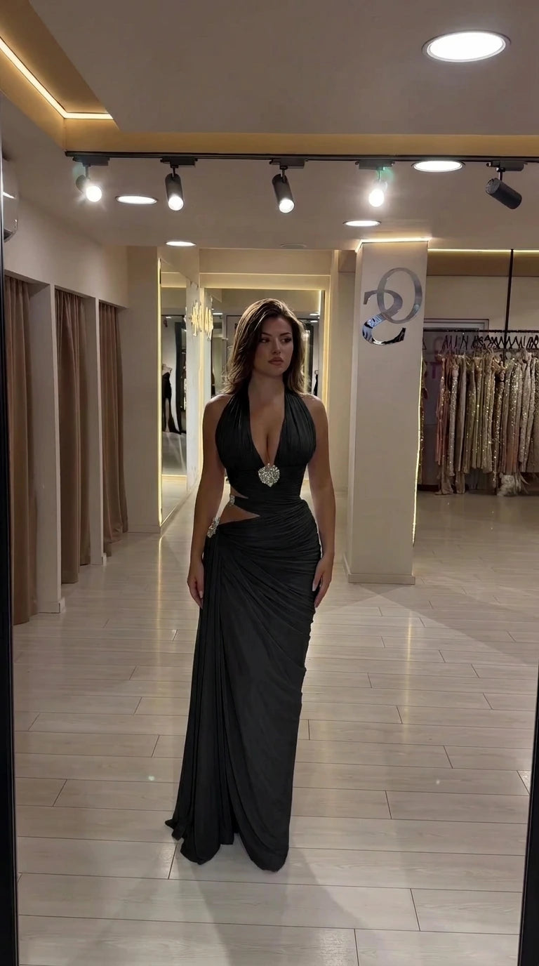 Black halter plunge ruched cutout maxi evening dress on model