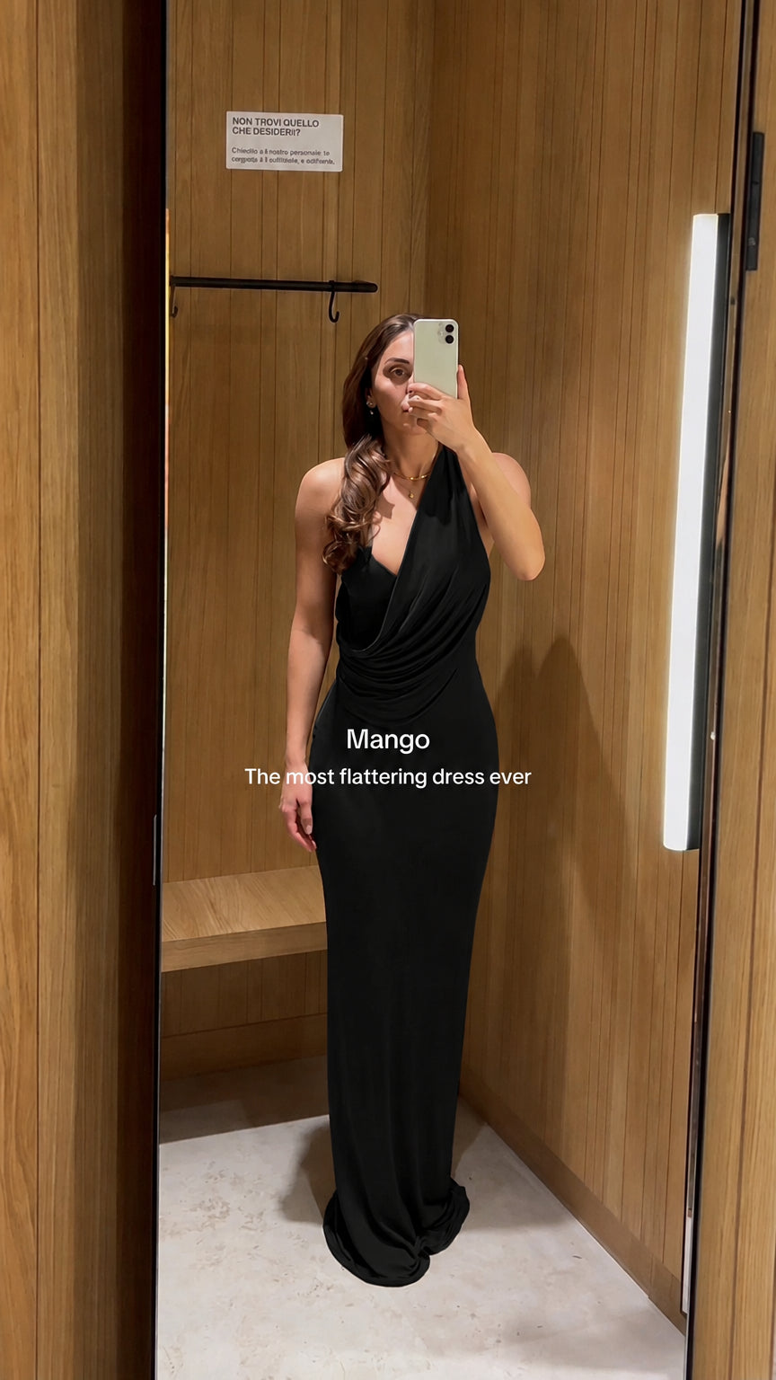 Front view of black cowl neck halter maxi dress on model