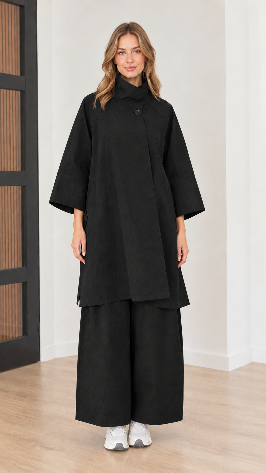 Front full view of women's mock neck tunic top and wide-leg pants two-piece set in black