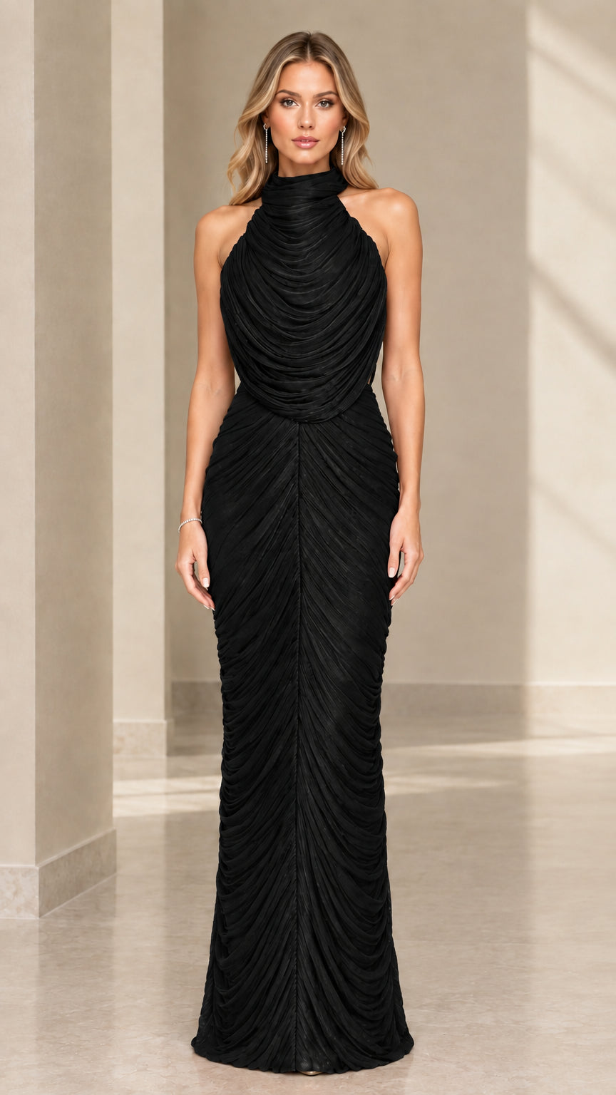 Front view of model wearing black high-neck pleated ruched sleeveless maxi gown