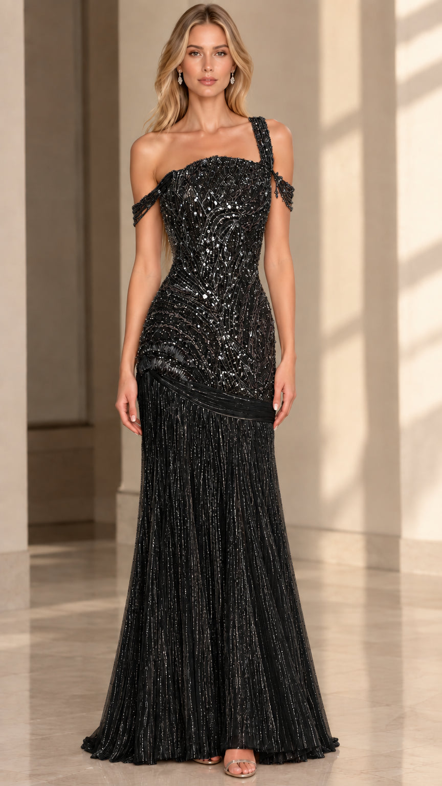 Front view of model wearing Black beaded one-shoulder formal evening dress with pleated skirt