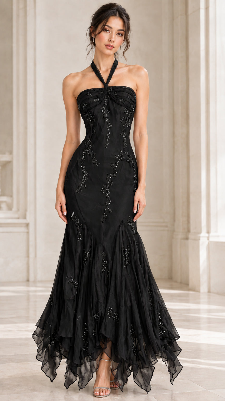 Front view of woman wearing black halter mermaid evening gown with beaded embroidery