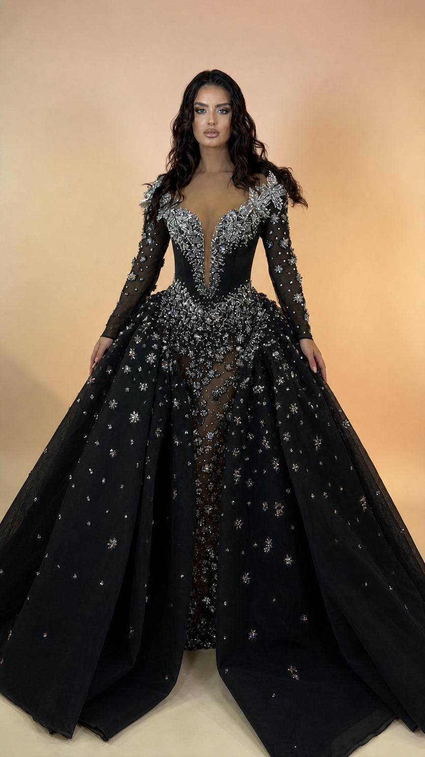 Full front view of black crystal embellished long sleeve ball gown