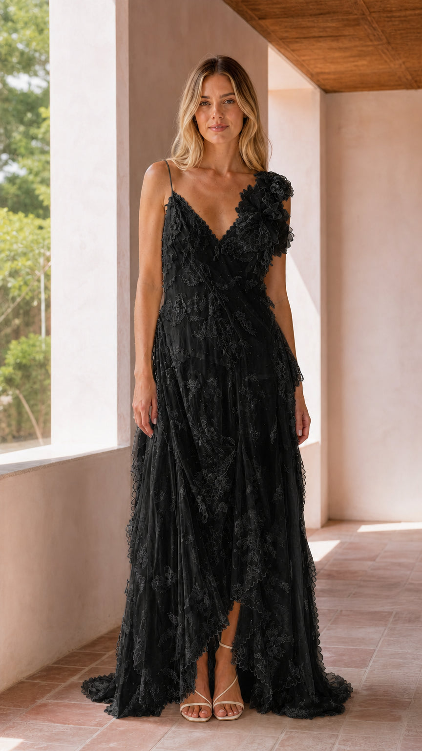 Front full-length view of black floral lace tiered evening maxi dress