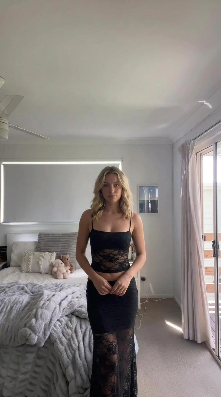 Model wearing black lace camisole top and matching lace detail maxi skirt