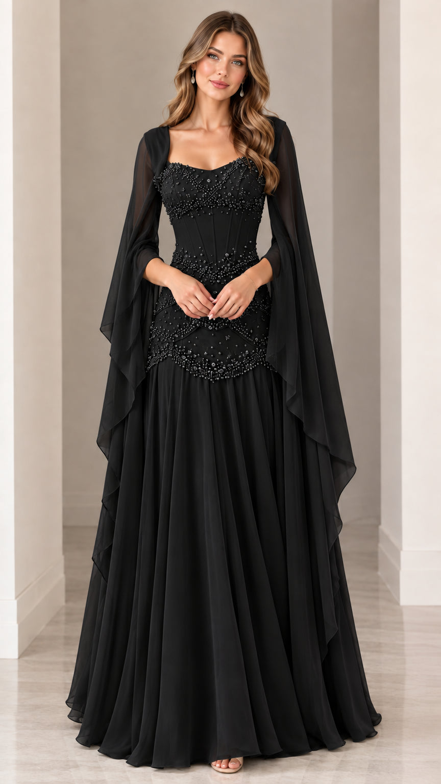 Front view of black pearl-embellished evening gown with sheer cape sleeves