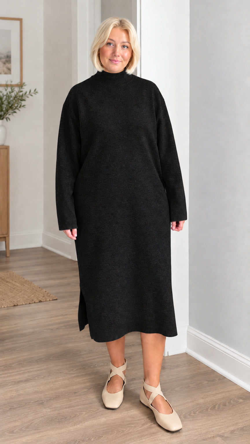 Front view of woman wearing black mock neck knit midi sweater dress