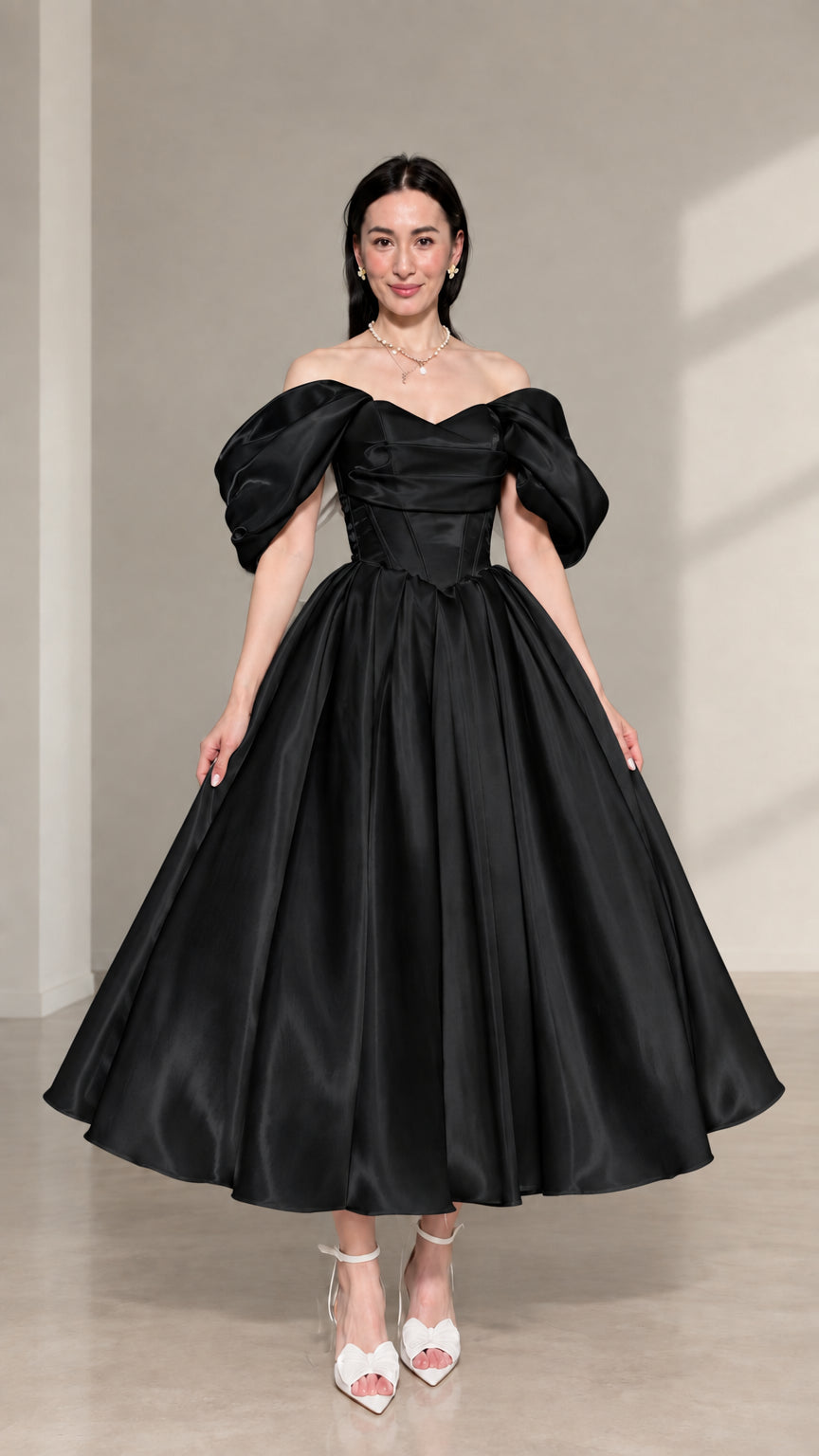 Front view of black off-the-shoulder corset satin midi dress with puff sleeves