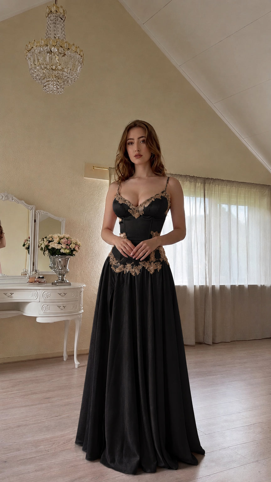 Front view of black satin evening dress with gold embroidered corset bodice