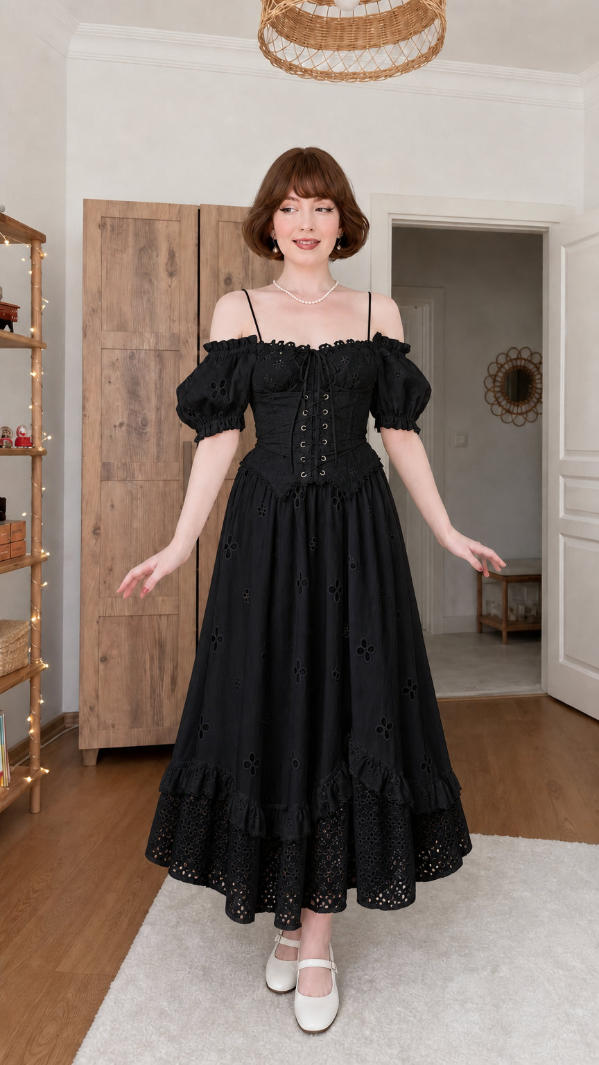 Woman wearing black off-shoulder corset eyelet midi dress