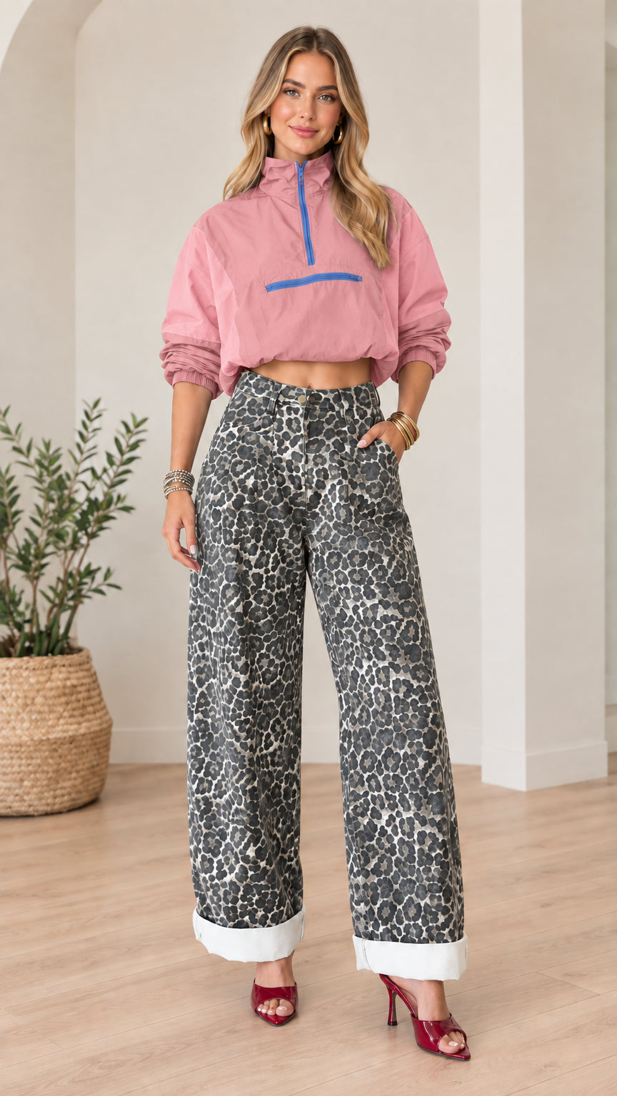 Front full view of pastel pink cropped half-zip windbreaker paired with leopard print wide-leg pants