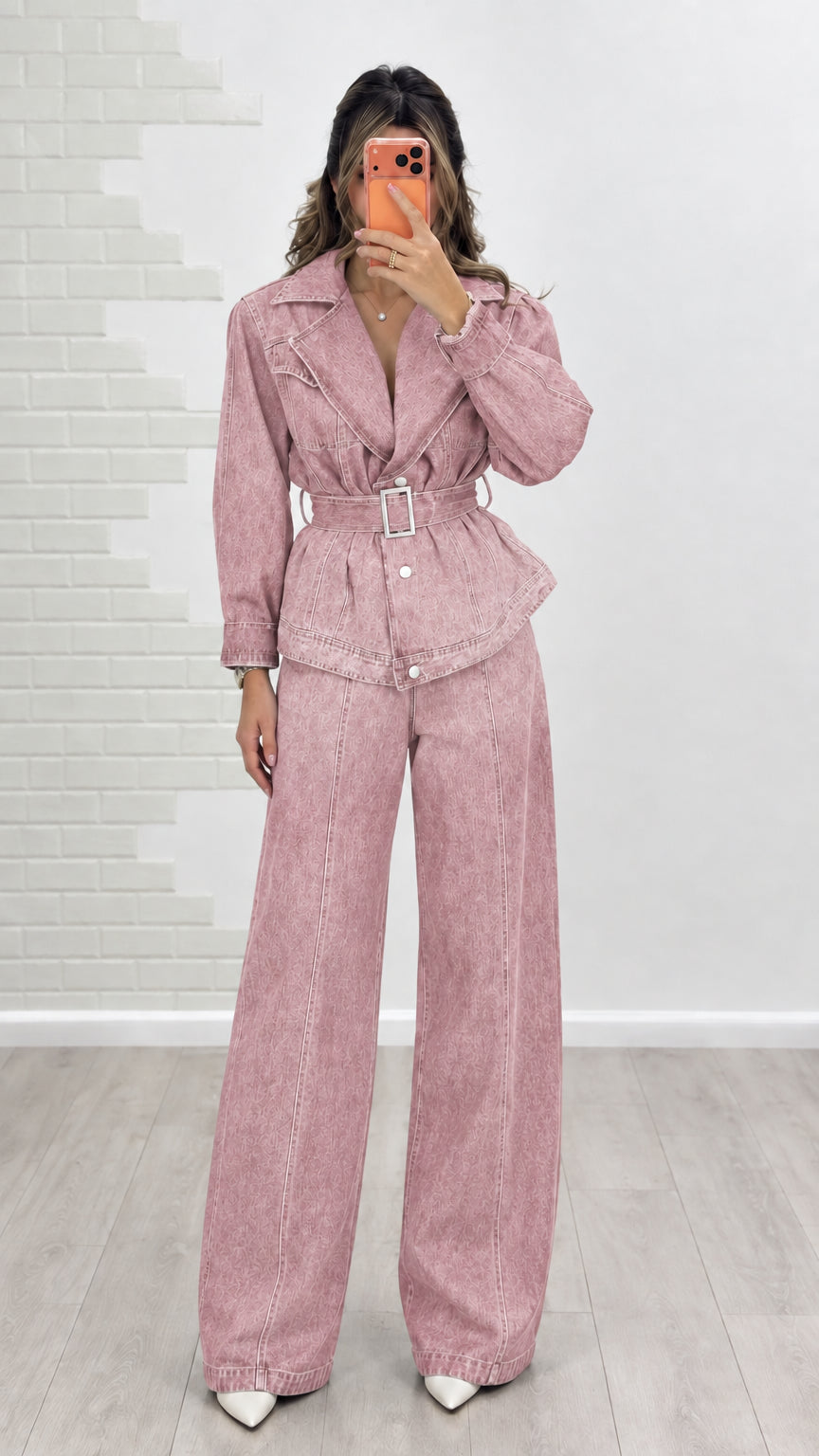 Model wearing dusty rose pink belted denim jacket and matching wide-leg trousers