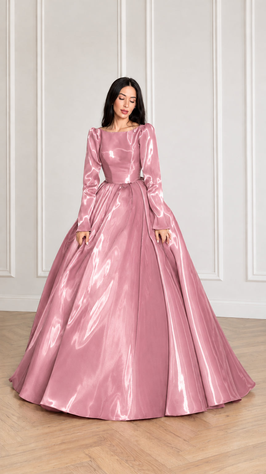 Front view of model wearing blush pink glossy long sleeve satin ball gown