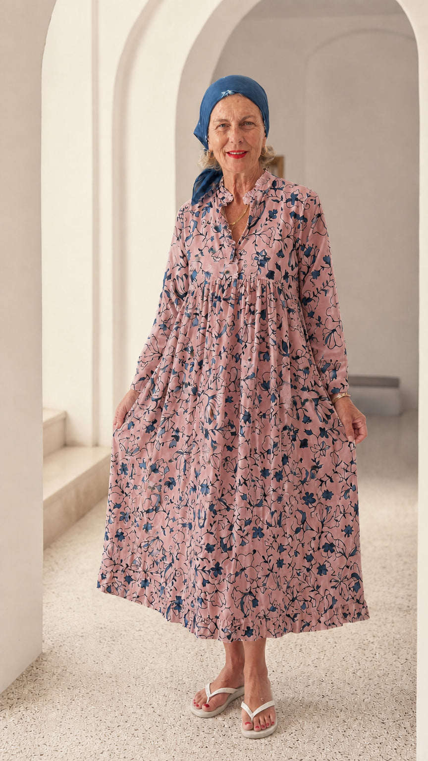 Front view of woman wearing Pink floral long sleeve relaxed smock dress