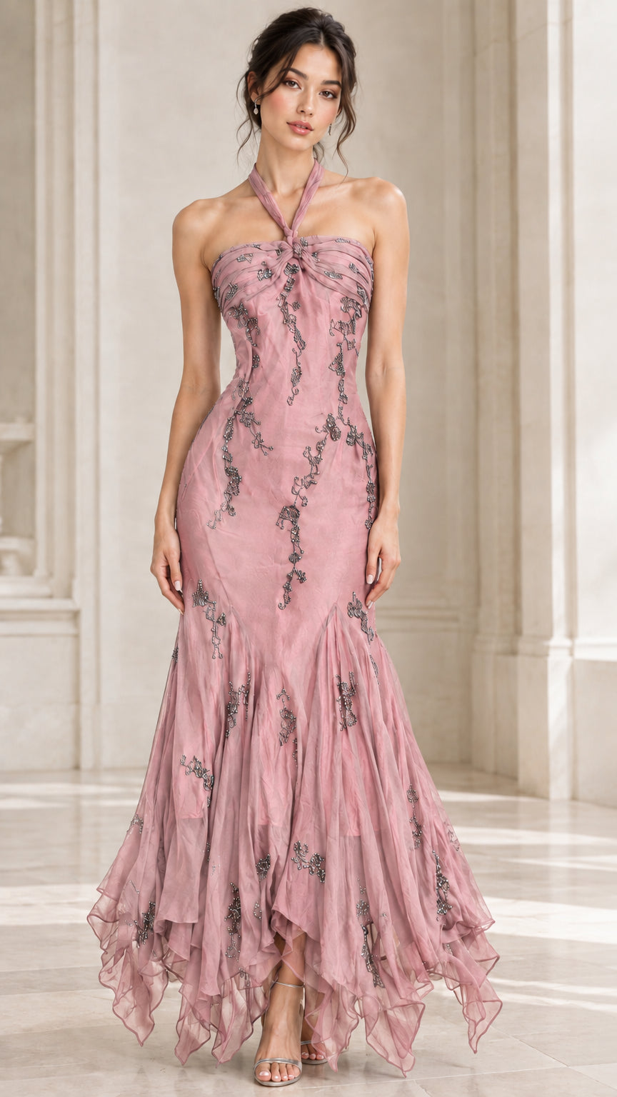 Front view of woman wearing dusty rose pink halter formal gown with tiered ruffle skirt