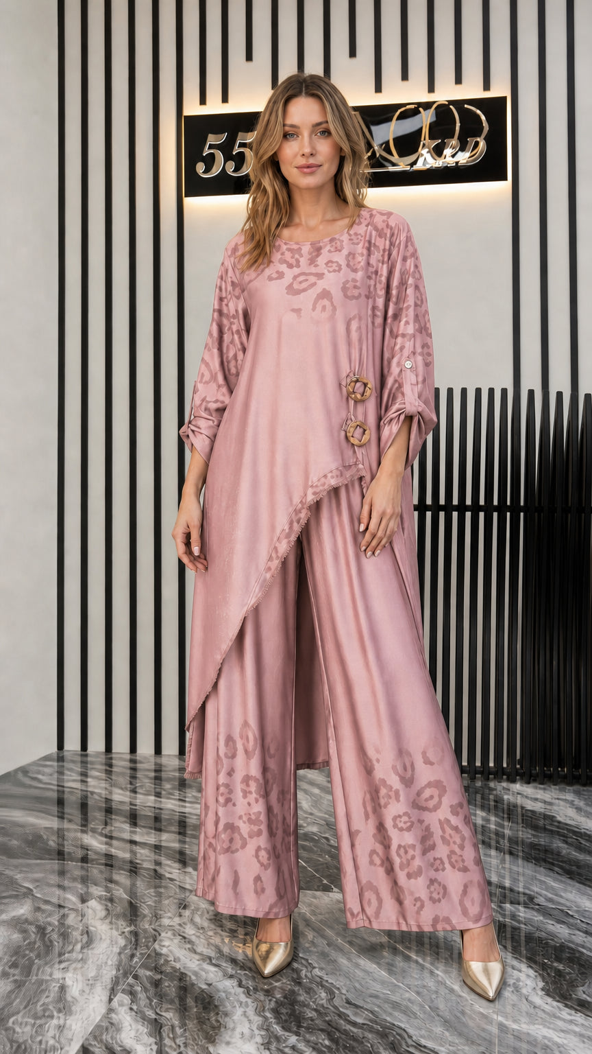 Front view of woman wearing dusty pink draped tunic and wide-leg pants set