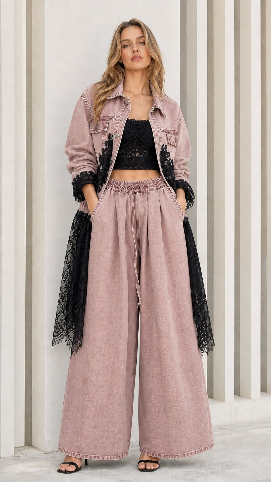 Model wearing dusty pink denim two-piece set with black lace trim