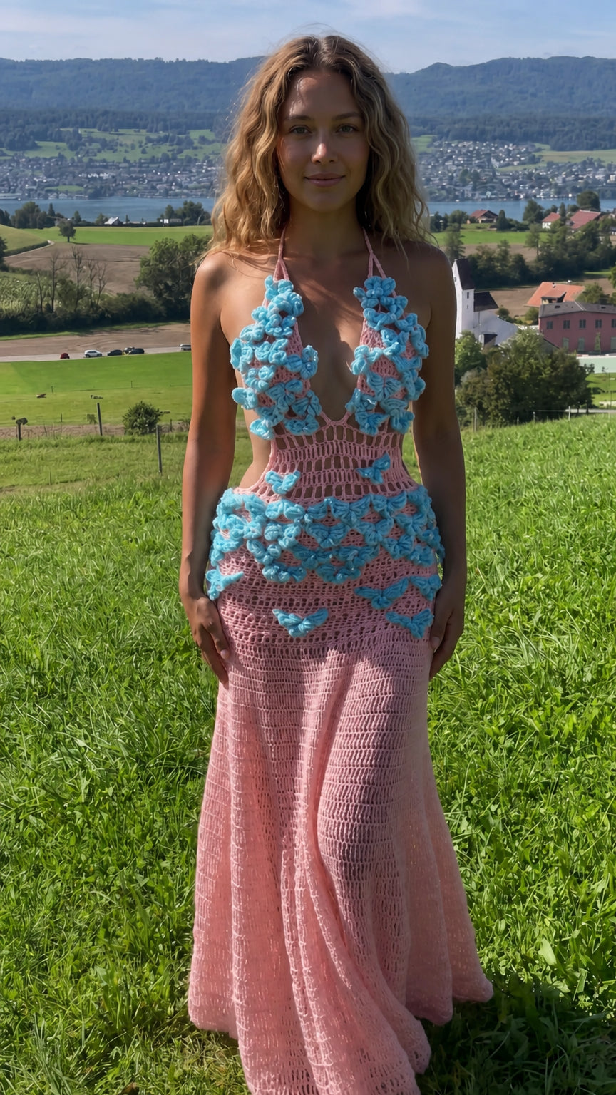Soft pink crochet halter maxi dress featuring turquoise floral accents and cutout bodice