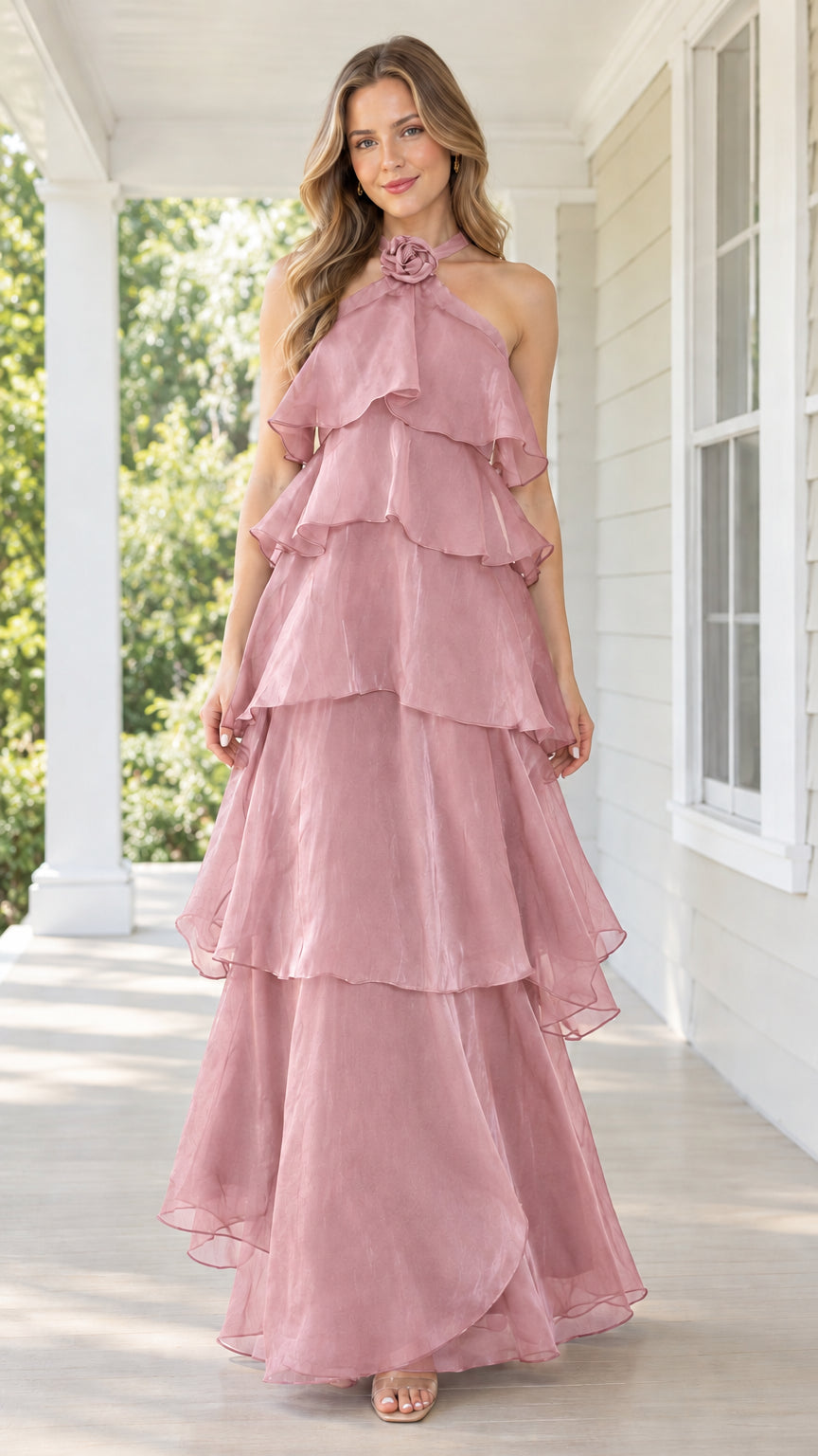 Front view of dusty pink tiered halter maxi dress with rosette neckline