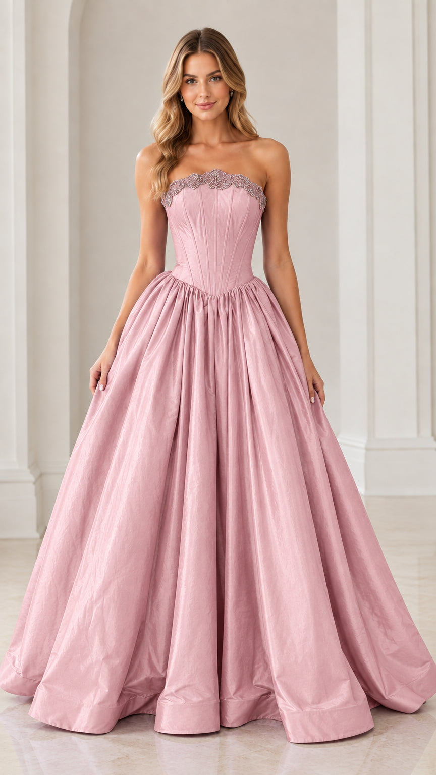 Model wearing elegant dusty pink strapless beaded corset ball gown