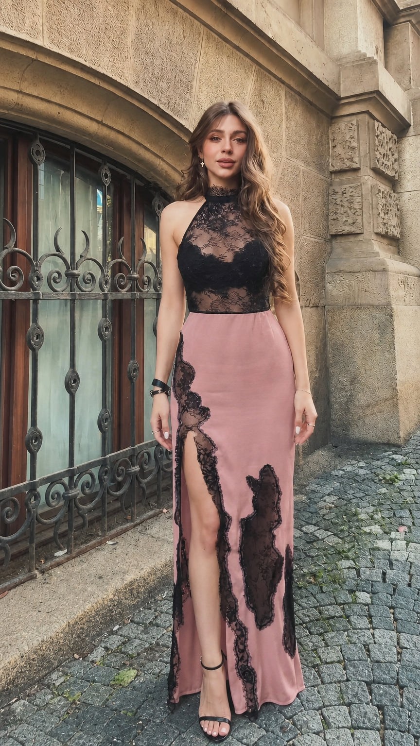 Front view of woman wearing dusty pink and black lace halter maxi dress