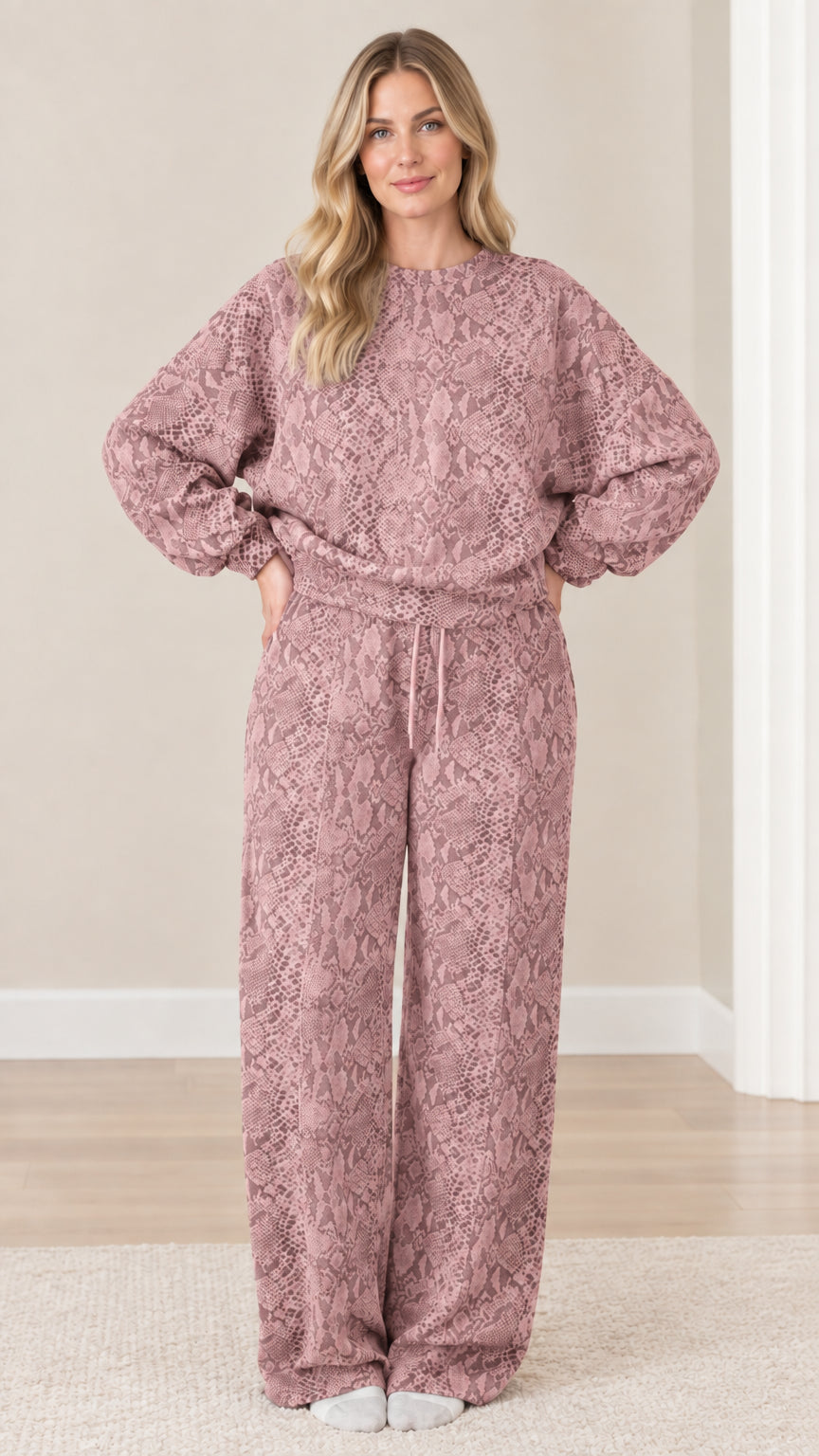 Front view of model wearing dusty rose pink snakeskin print two-piece loungewear set