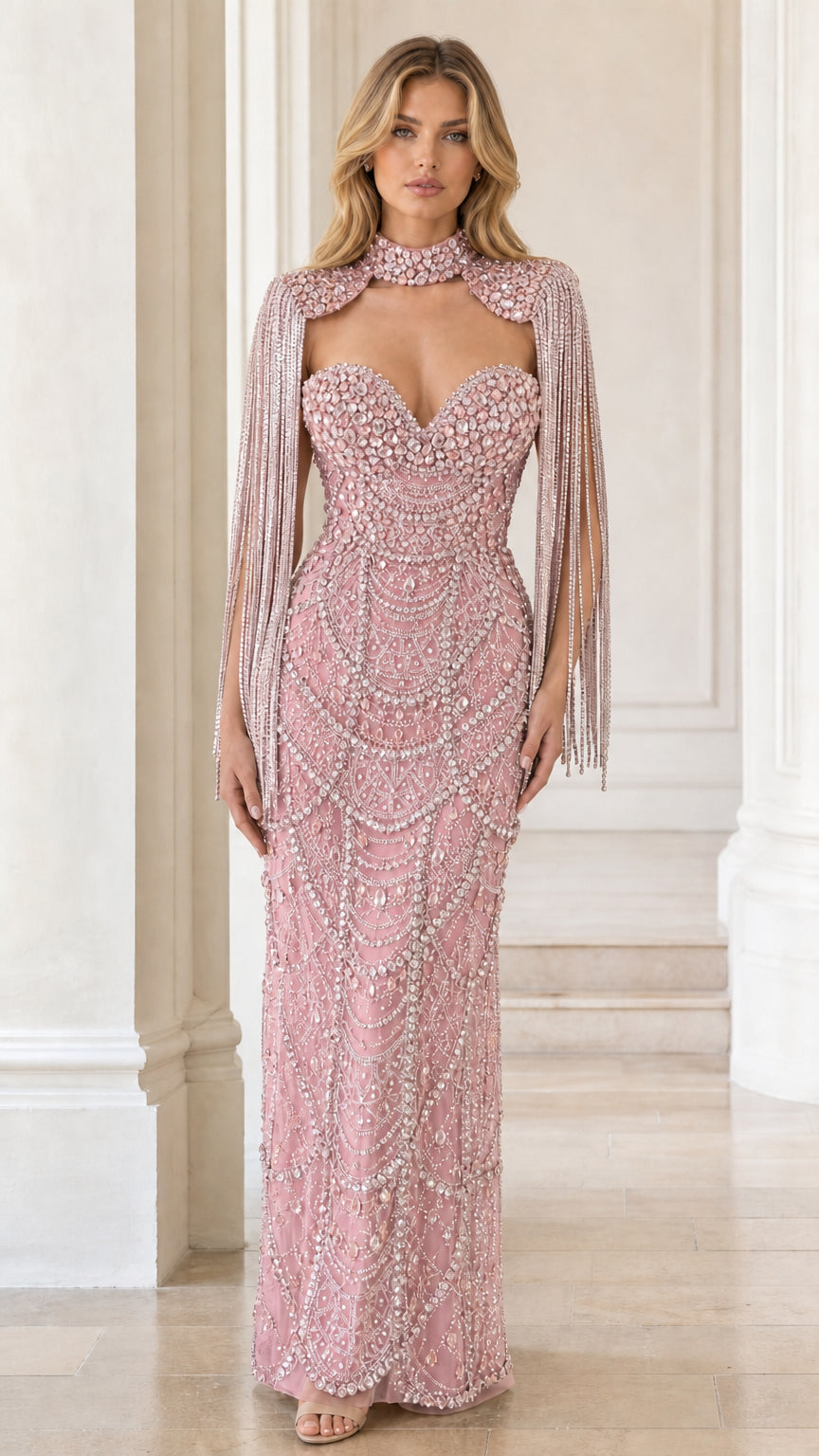 Front view of blush pink crystal embellished formal gown with capelet