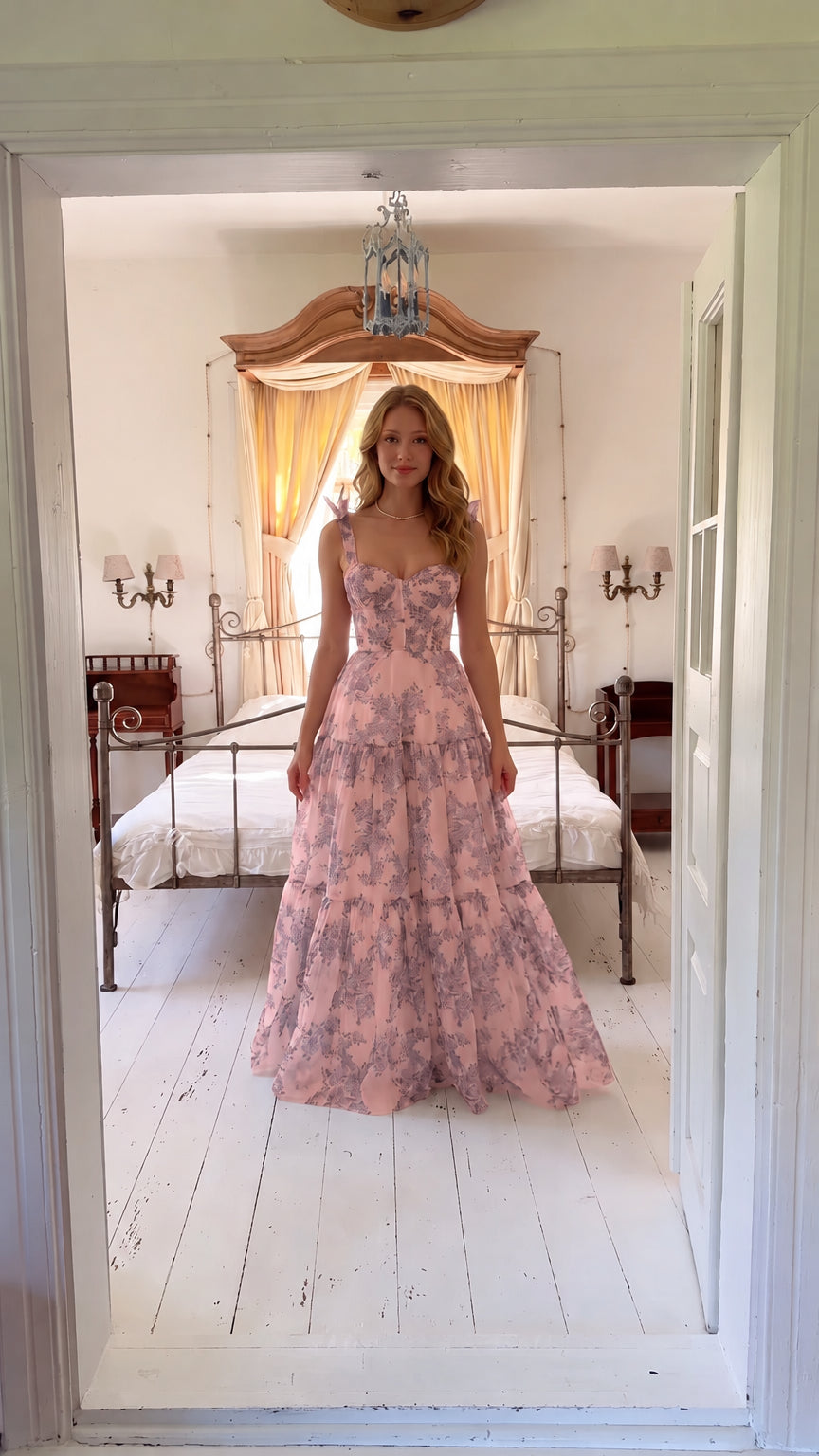 Front view of woman wearing pink floral corset maxi dress with sweetheart neckline