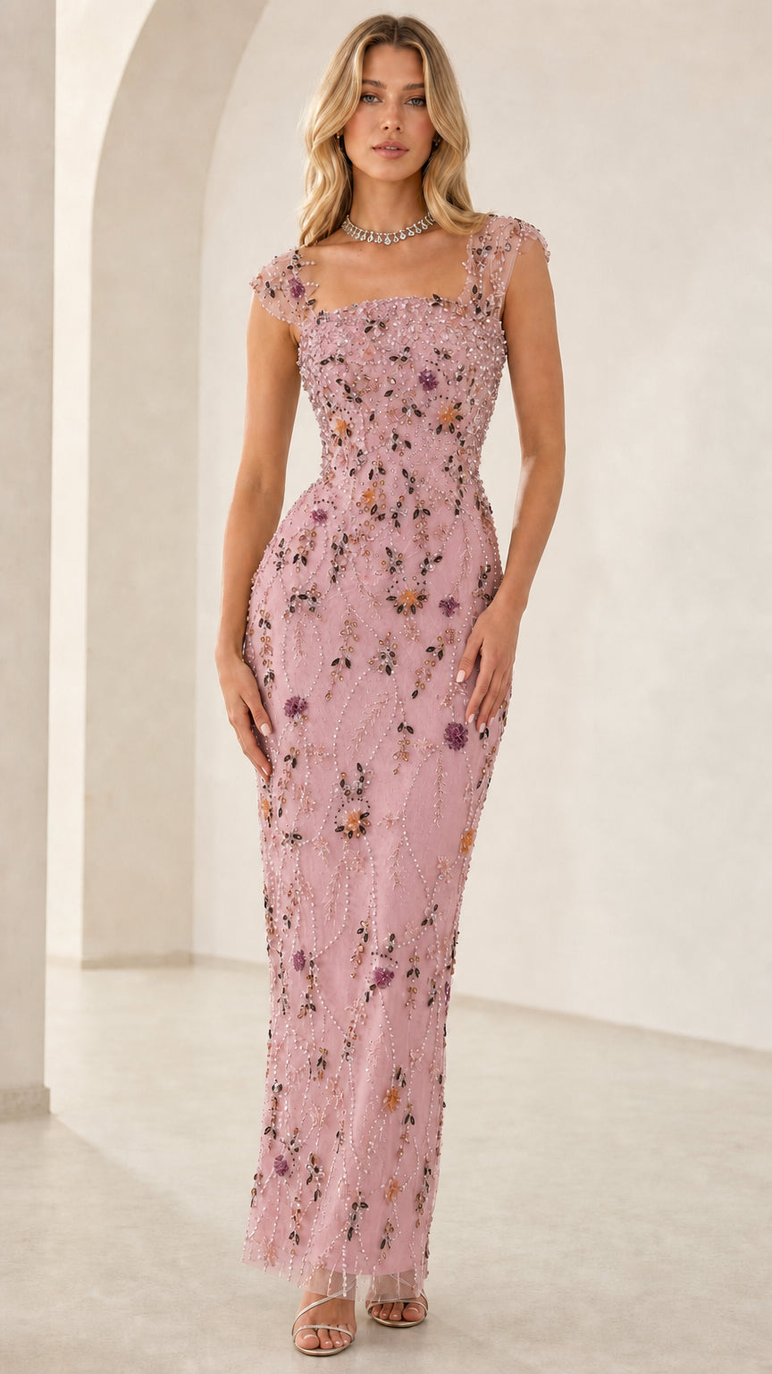 Model wearing blush pink floral beaded formal evening dress