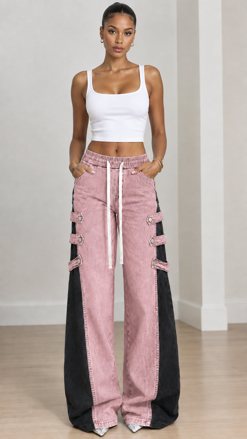 Full front view of pink and black contrast wide-leg denim jeans with drawstring waist