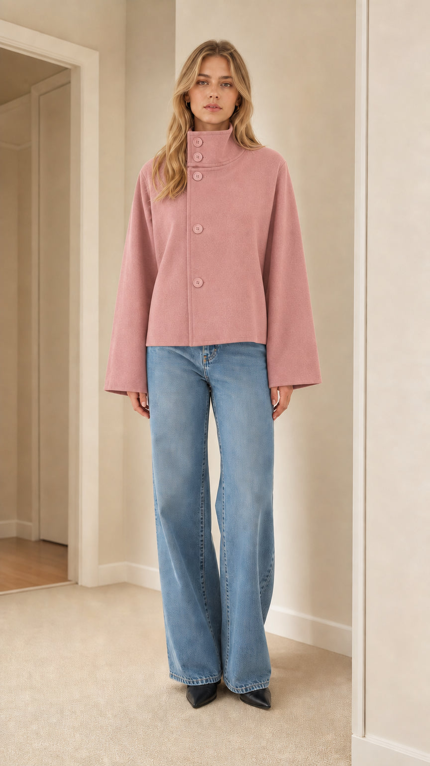 Front view of model wearing dusty pink high neck cropped jacket