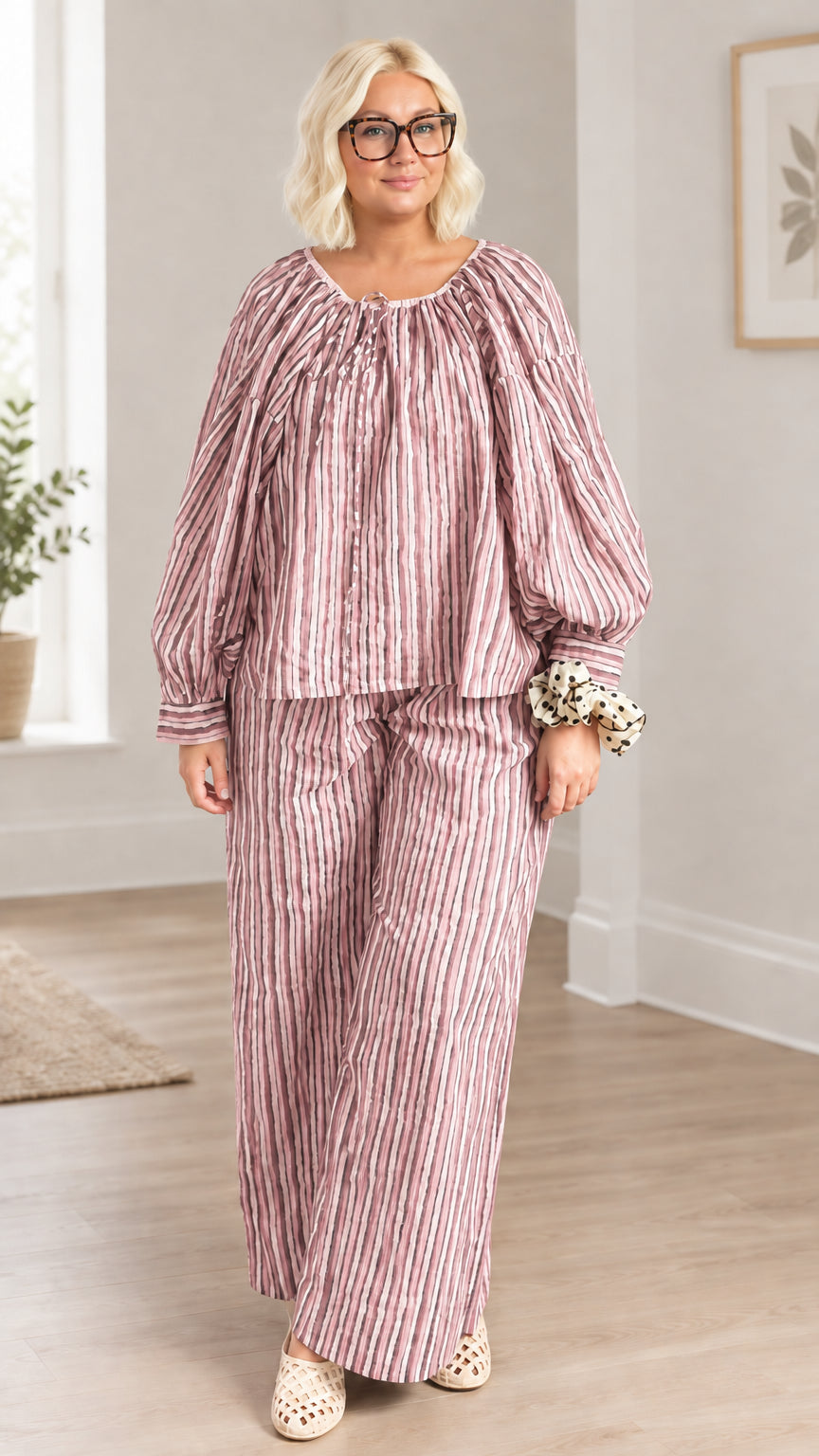 Full front view of model wearing dusty rose pink striped two-piece pant set