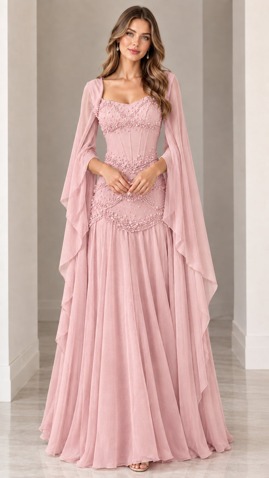 Front view of blush pink beaded formal evening gown with drape cape sleeves