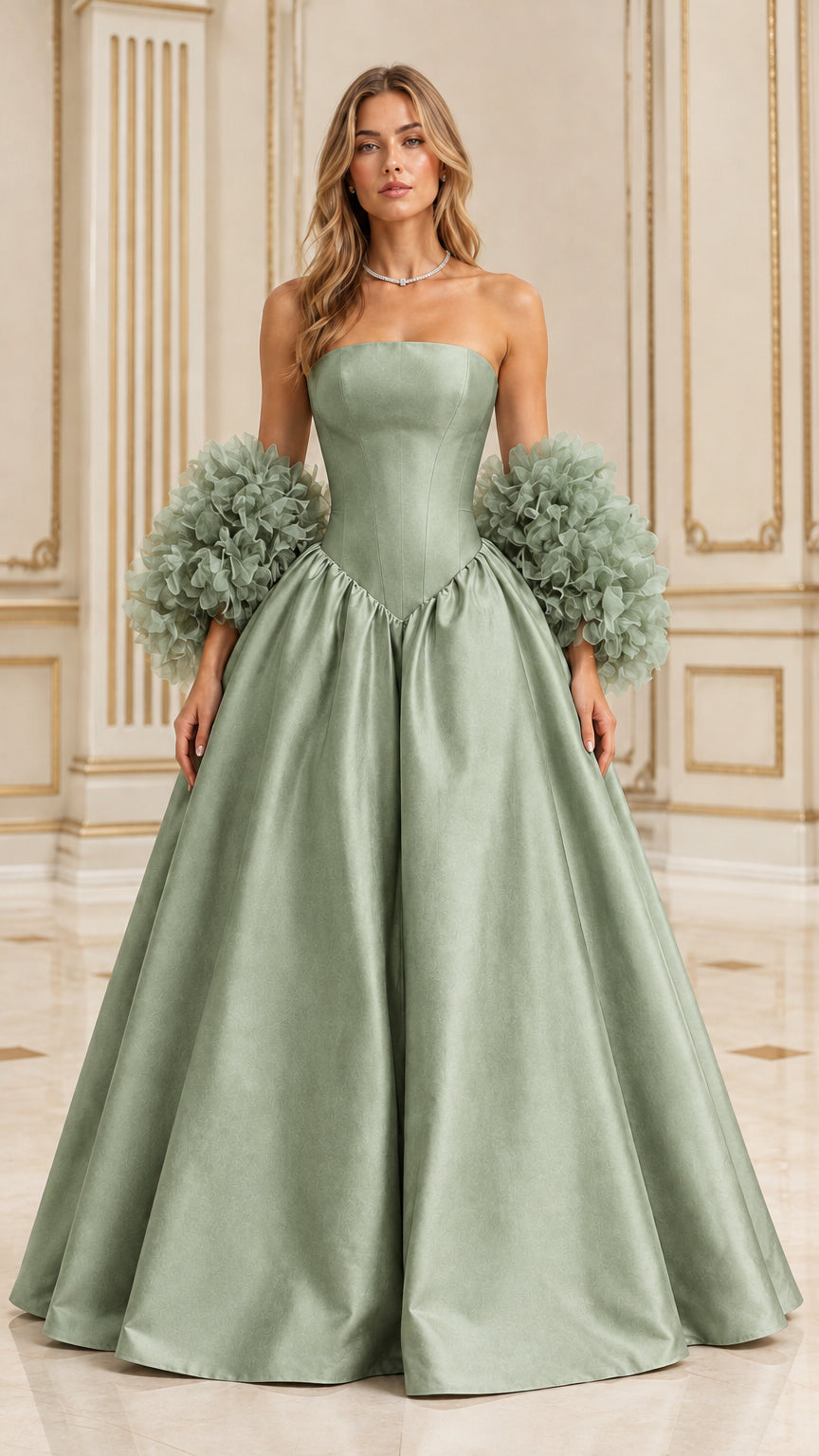 Front view of sage green strapless ball gown with structured basque bodice and textured sleeves