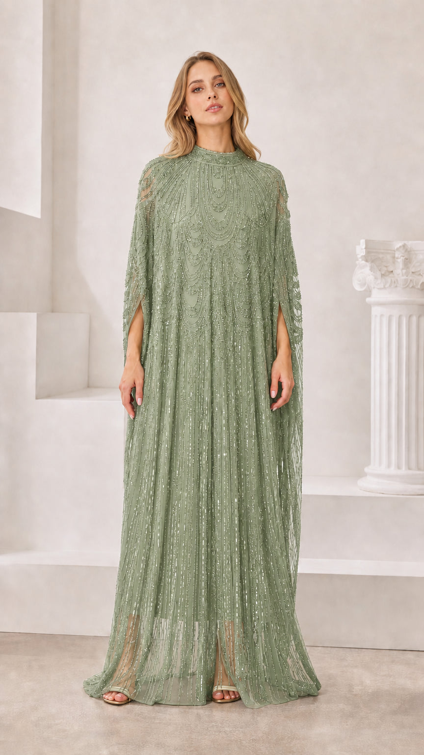 Front view of sage green beaded sequin cape maxi dress