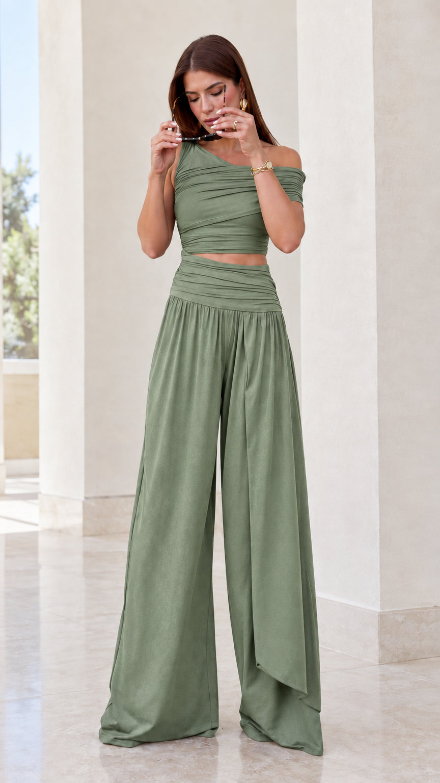 Front view of sage green asymmetrical ruched matching top and pants set