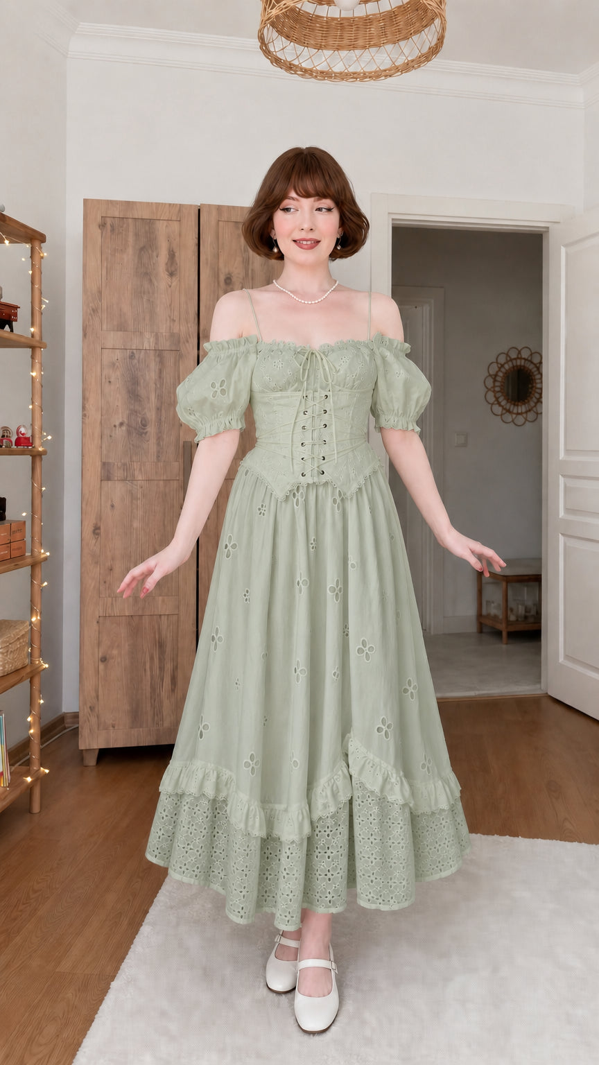 Woman wearing sage green vintage eyelet corset midi dress