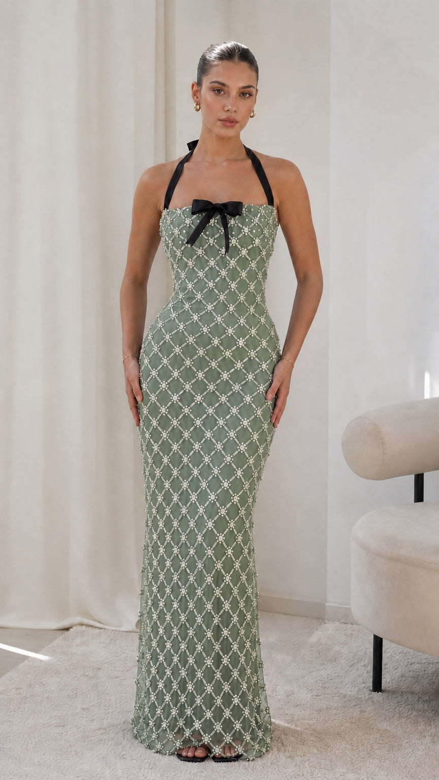 Model wearing sage green embellished lattice halterneck maxi dress