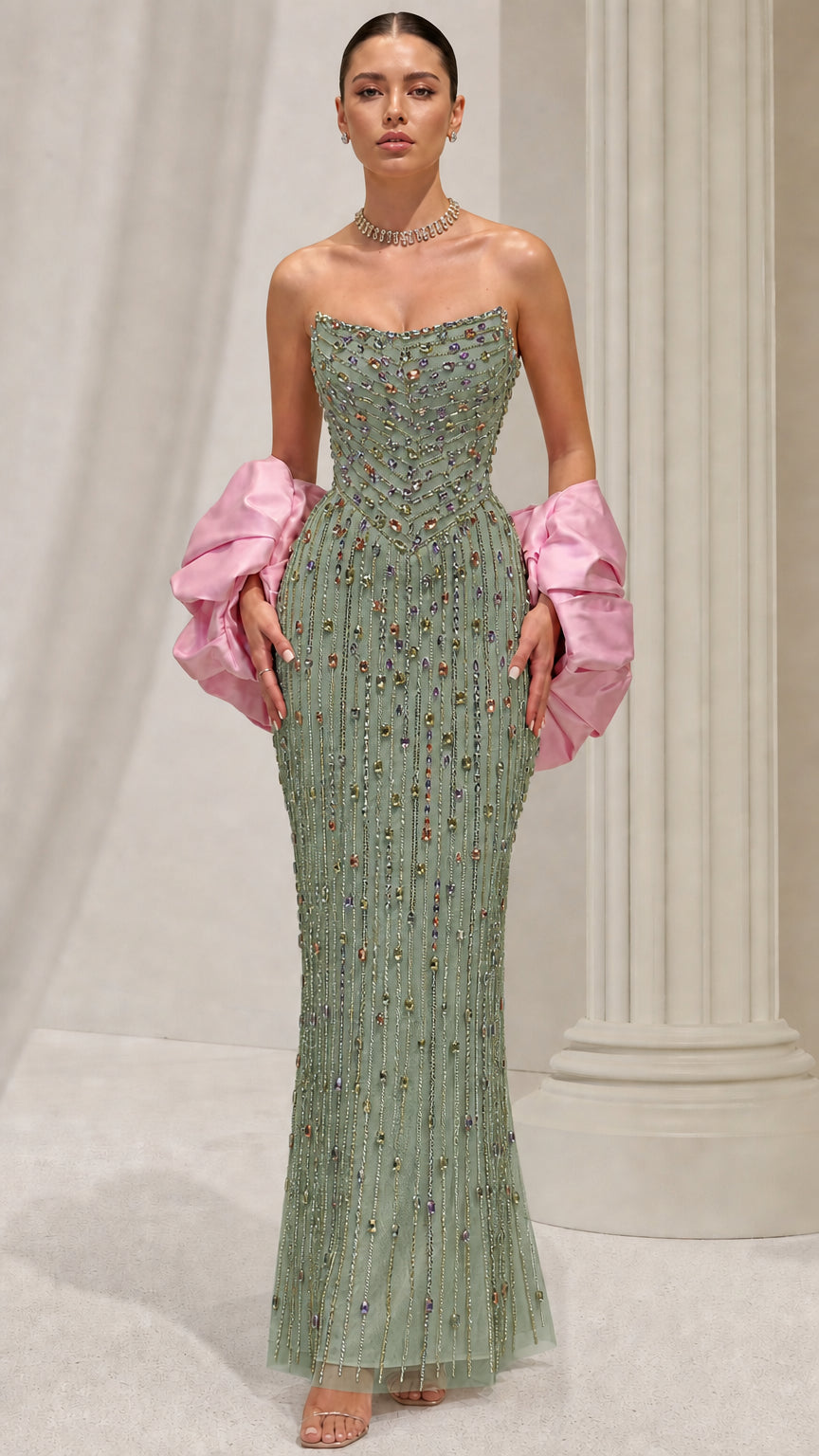 Sage green strapless beaded formal gown styled with pink puffed arm cuffs