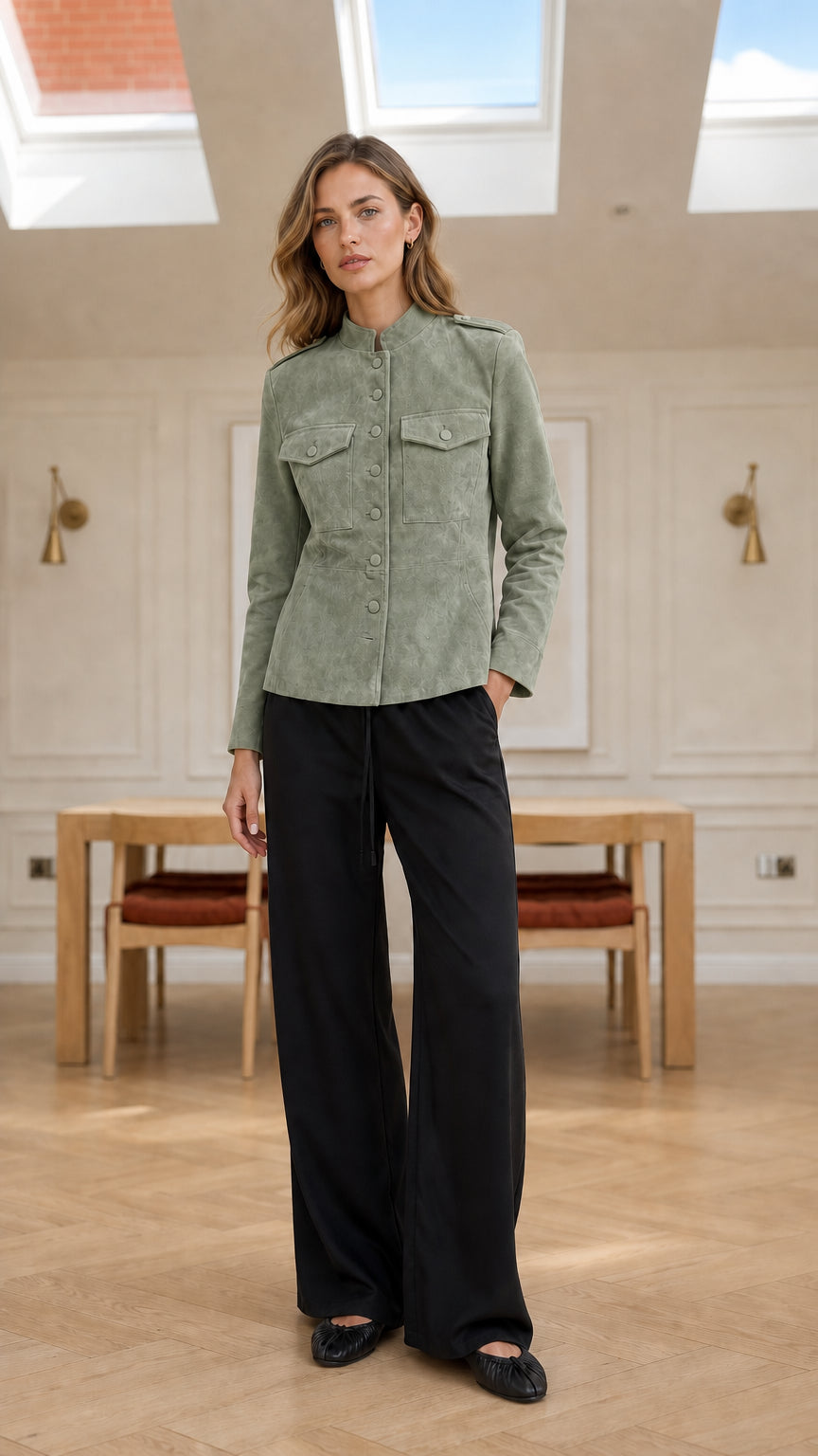 Model wearing sage green faux suede button-up utility jacket