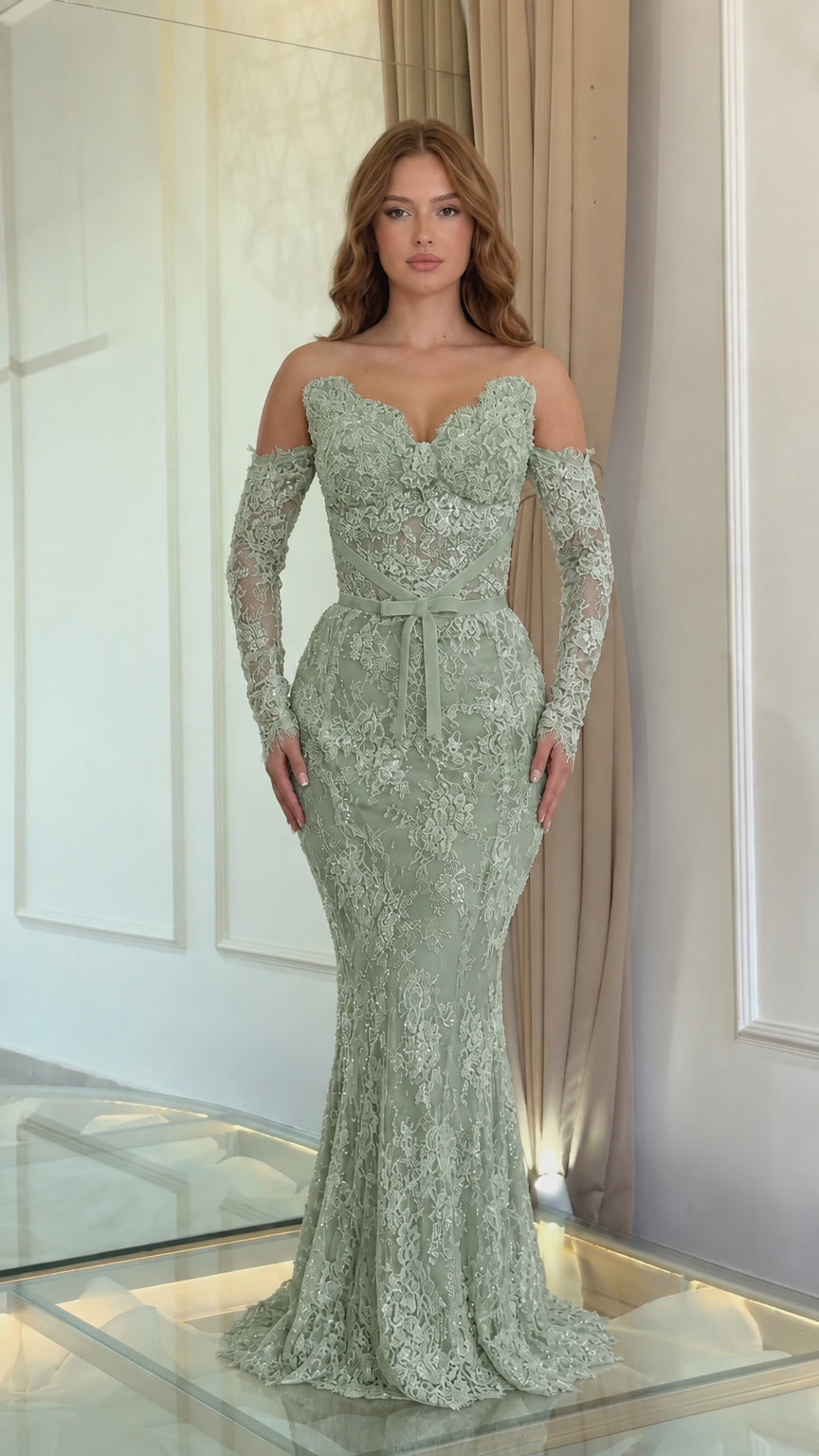 Full front view of a model wearing a sage green lace off-the-shoulder evening gown with long sleeves