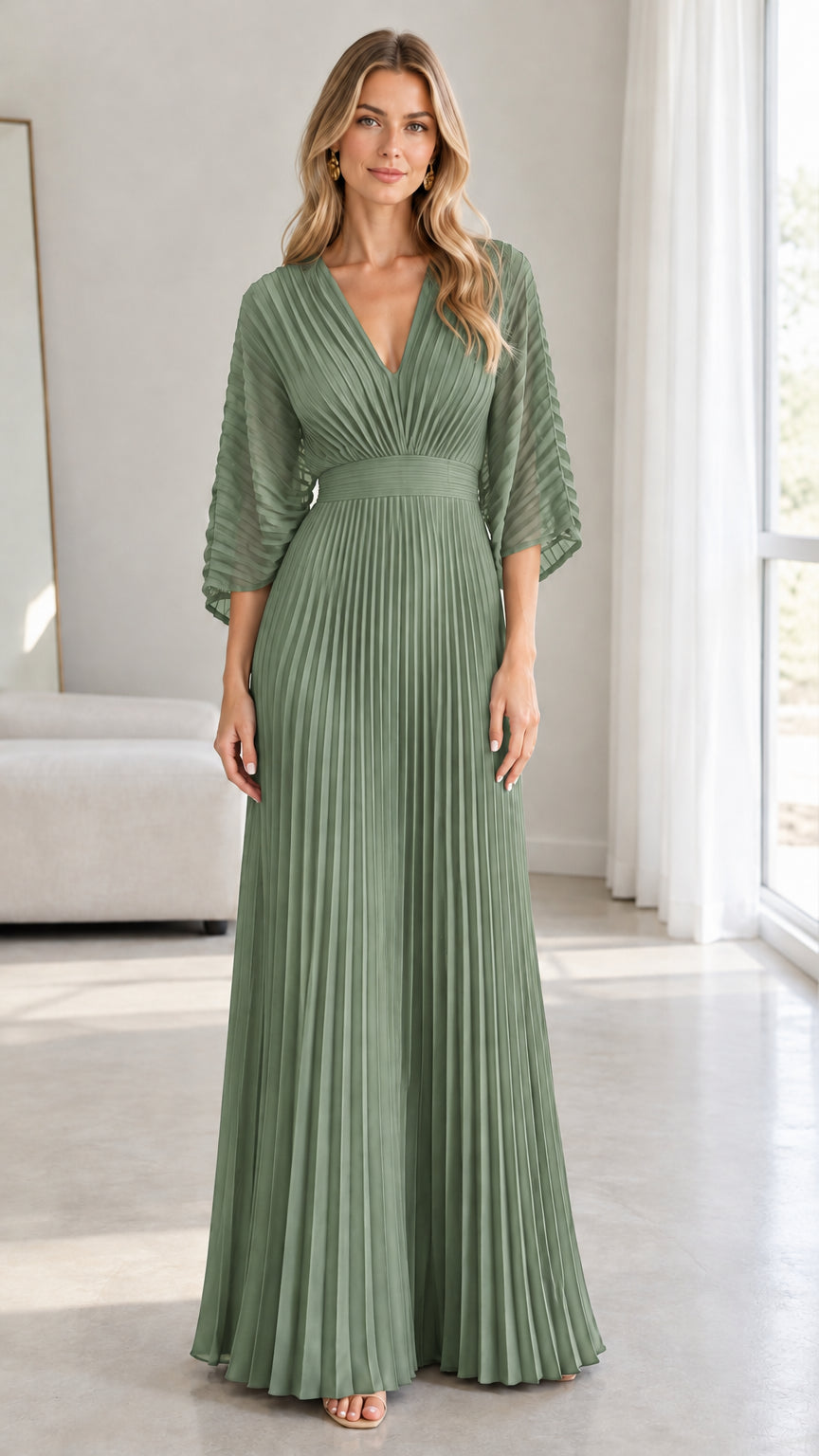 Front view of model wearing the sage green pleated maxi evening dress