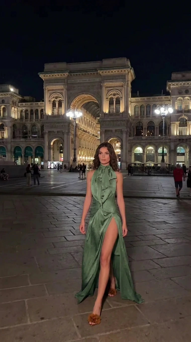 Woman modeling sage green satin halter neck formal maxi gown