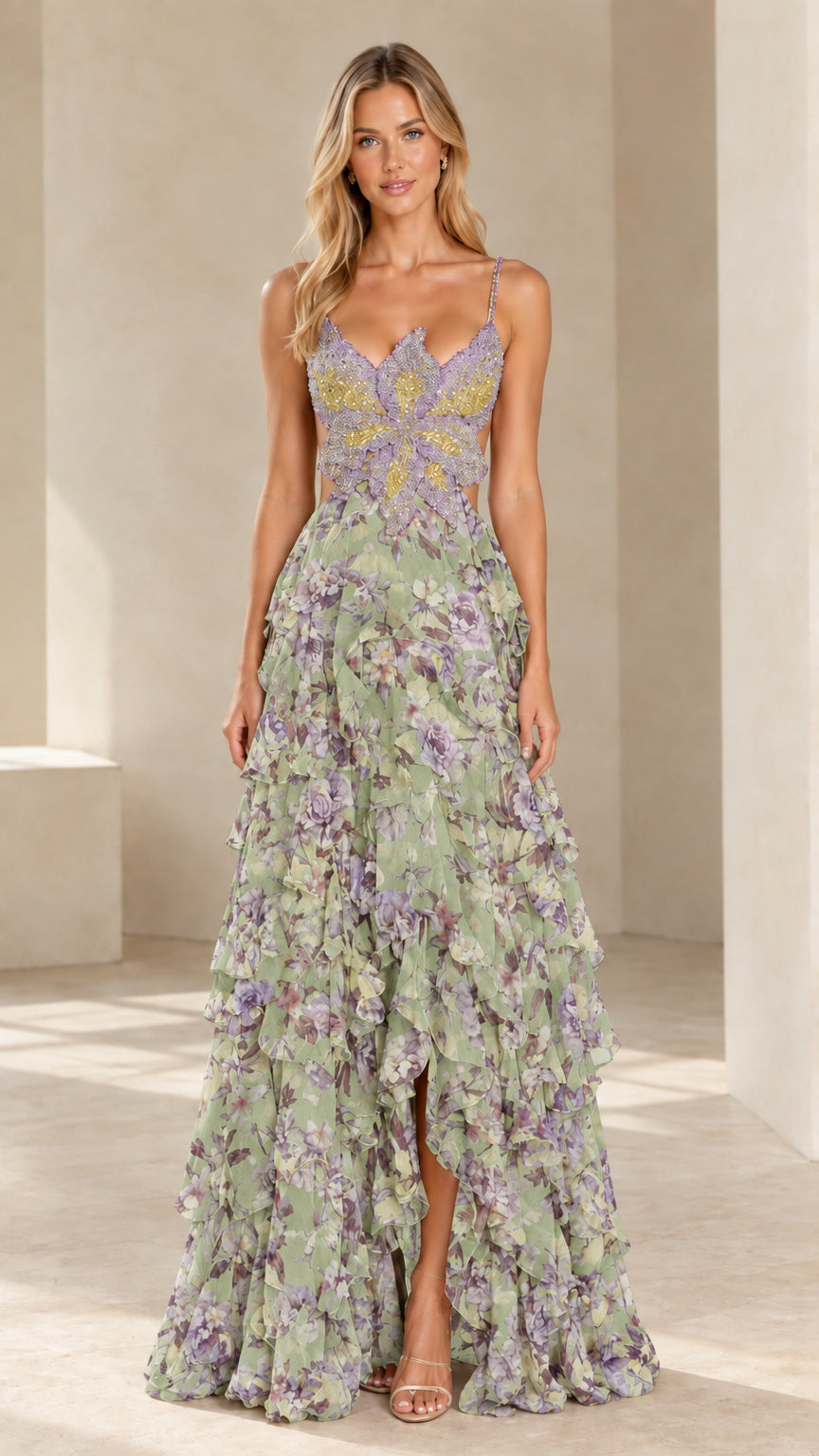 Front view of model wearing sage green floral beaded butterfly bodice tiered evening gown
